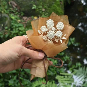 handmade silver sunflower bouquet with multiple stems wrapped in kraft paper, sterling silver flower gift