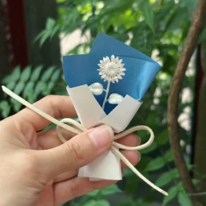 silver sunflower in blue and white paper wrapping, handmade sterling silver flower gift