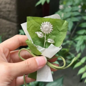silver sunflower gift single stem wrapped in green paper with suede tie, handmade sterling silver