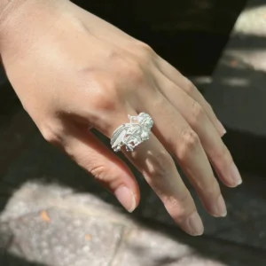 handmade silver lily of the valley ring on hand outdoors, natural light botanical ring