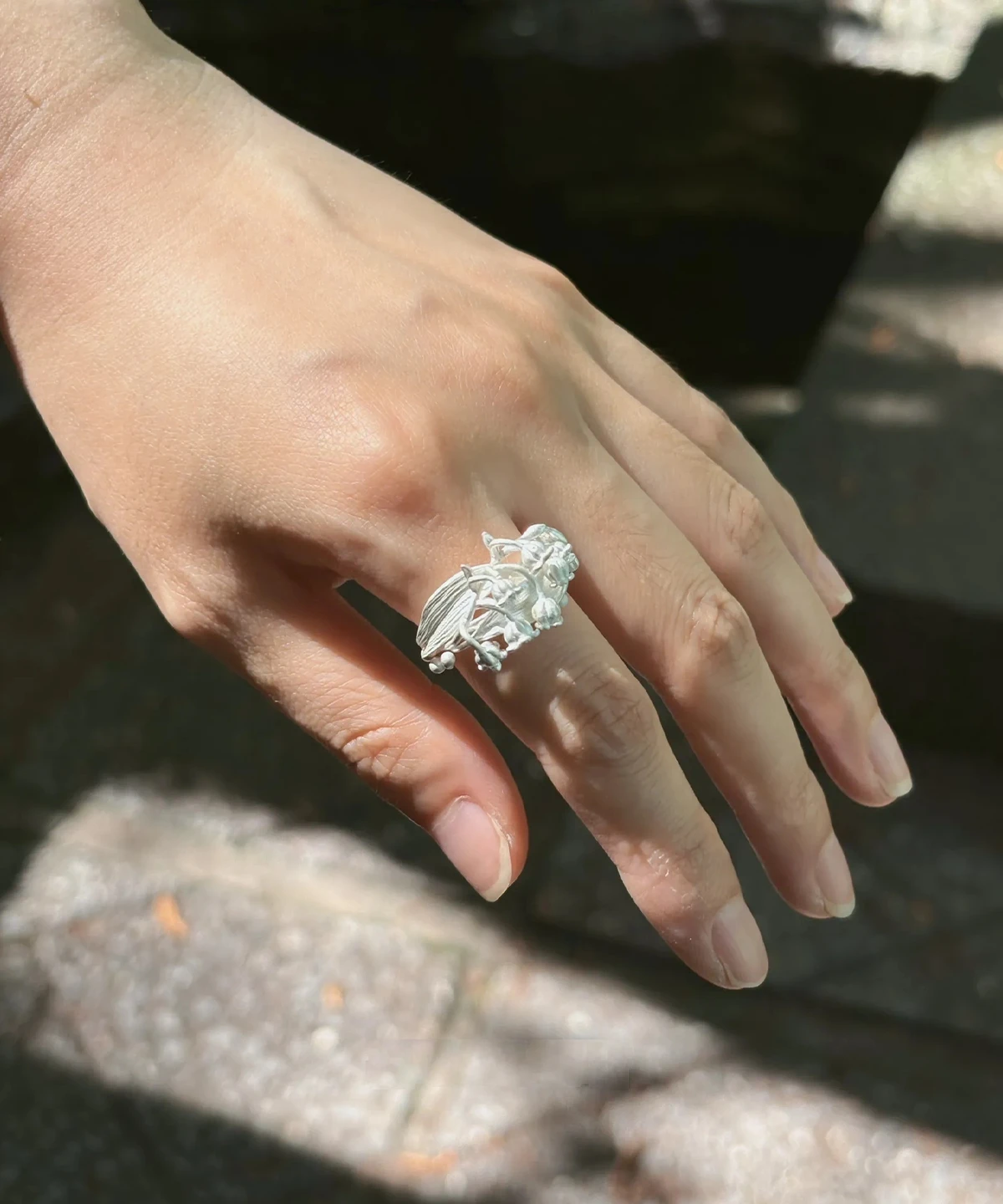 Handmade Silver Lily of the Valley Ring – Outdoor Natural Light handmade silver lily of the valley ring on hand outdoors, natural light botanical ring