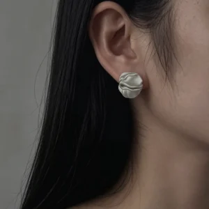 Handmade Sterling Silver Stud Earrings – Model Wear handmade sterling silver stud earrings worn on model, sculptural petal design