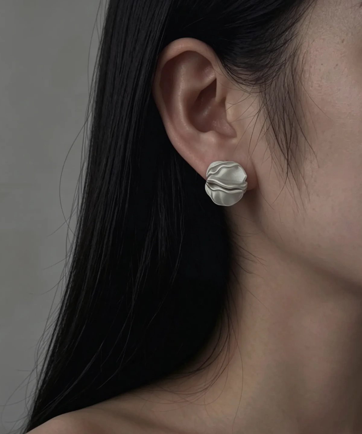 Handmade Sterling Silver Stud Earrings – Model Wear handmade sterling silver stud earrings worn on model, sculptural petal design