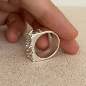 Tidemark ring side profile showing band thickness and smooth interior, wide silver band ring in 999 fine silver