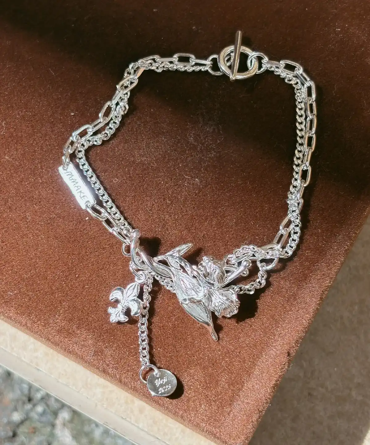 Personalized silver iris bracelet with layered chains, sculpted flower and engravable charms