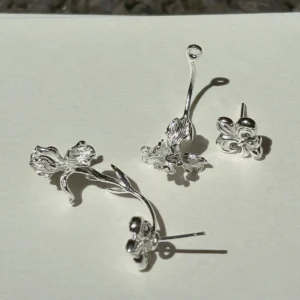 Silver iris ear jacket earrings in S925 shown as separate fleur-de-lis studs and long-stem iris jackets