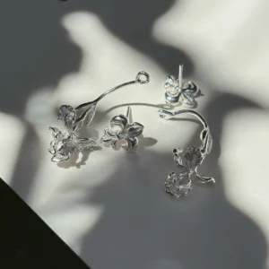 S925 iris ear jacket earrings displayed as a four-piece pair in strong botanical shadows