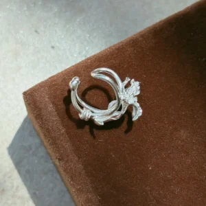 Silver flower ear cuff in S925, C-shaped open band with one bud-shaped end and one smooth rounded end
