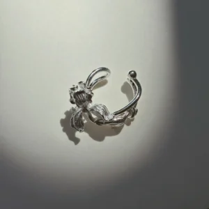 Handmade silver iris ear cuff in S925 sterling silver, curved band shaped to grip the ear