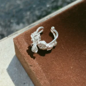 Silver iris flower ear cuff in S925, cast iris bloom on a stem with a bud terminal