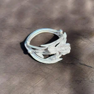 Silver iris ring on stone, openwork band of stems and leaves with rounded bud terminals