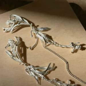 S925 floral dangle earrings close up with iris flowers, layered leaves, connecting rings, and chain