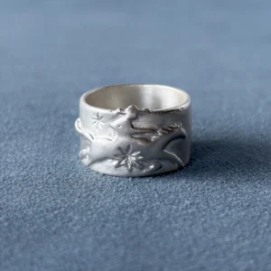 999 fine silver Cowboy Horse Ring with western horse engraving on blue fabric