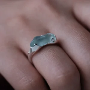 Irregular natural aquamarine custom ring in S925 sterling silver worn on a finger