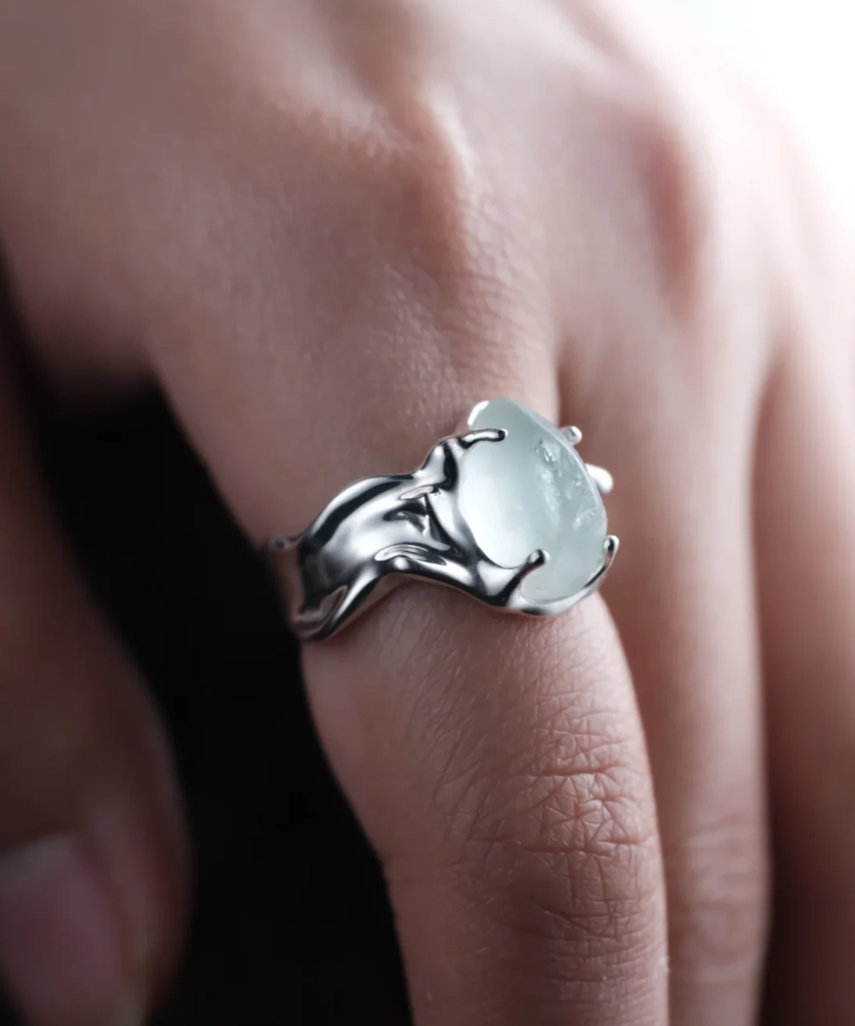 Large irregular natural aquamarine ring in S925 sterling silver worn on a finger