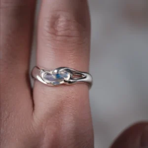 Natural opal custom gemstone ring in S925 sterling silver worn on a finger