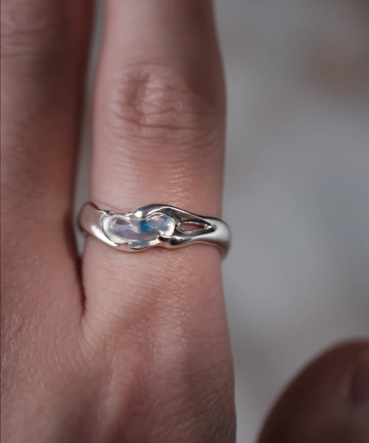Natural opal custom gemstone ring in S925 sterling silver worn on a finger