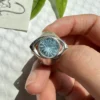 Close-up of Six Eyes Ring featuring a natural blue topaz gemstone set in S925 sterling silver