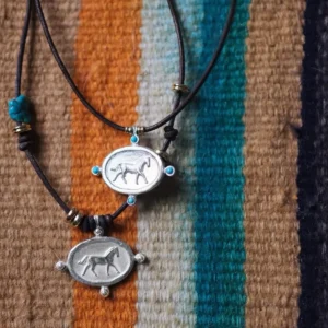Sterling silver horse necklace with turquoise details and black leather cord
