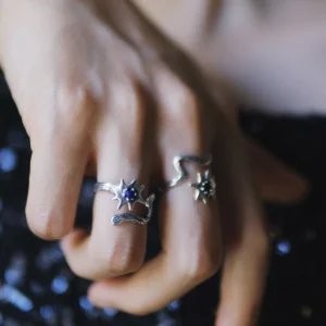 Celestial silver ring with blue centre shown in a close hand view