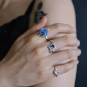 Lapis lazuli star ring paired with a larger faceted blue stone ring