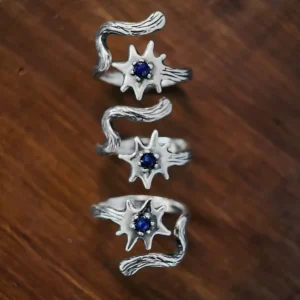 925 sterling silver lapis lazuli ring shown in three orientations on warm wood