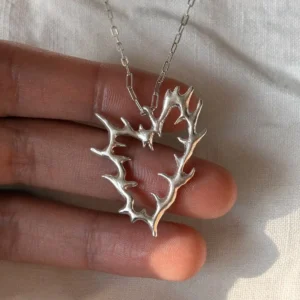 Branch-like open heart pendant in 999 fine silver on a rectangular-link silver chain