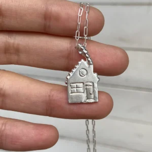 Small 999 fine silver house pendant with round window, square window and door on a silver chain