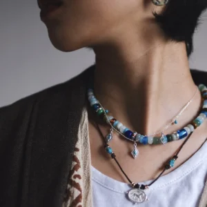 Short amazonite necklace worn in a layered editorial look