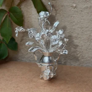 Four-stem phalaenopsis arrangement in a miniature 990 silver vase