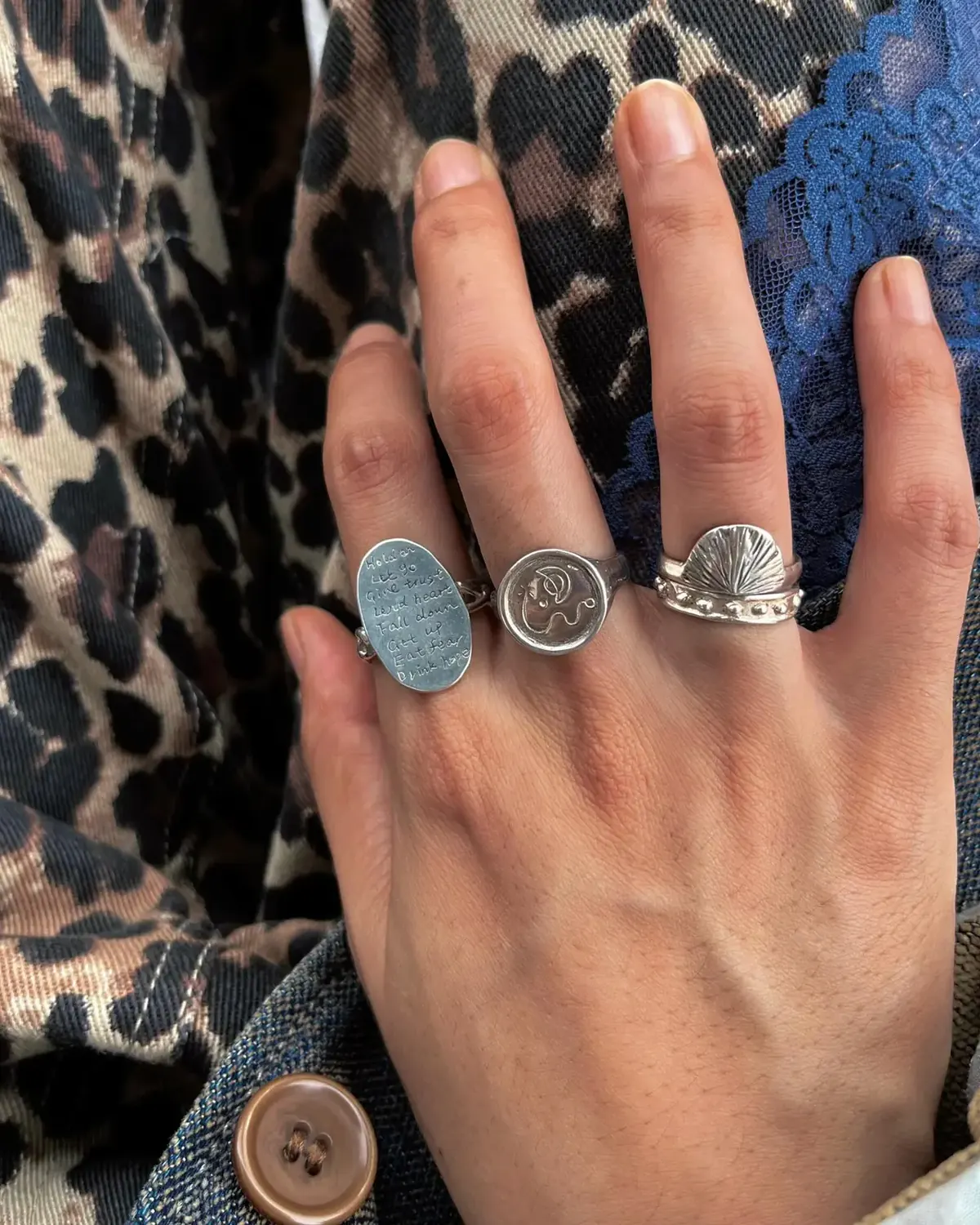Gold-toned Narrative Verse signet mixed with silver signet and carved rings