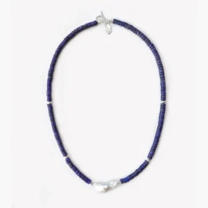Full view of a lapis lazuli and baroque pearl necklace on white