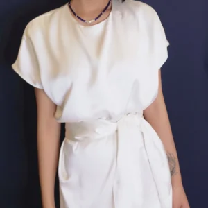 Short lapis lazuli pearl necklace worn with a white dress