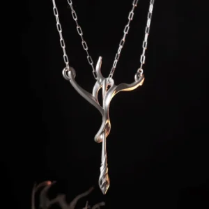 Front detail of a matte sterling silver bow and arrow pendant on a split chain