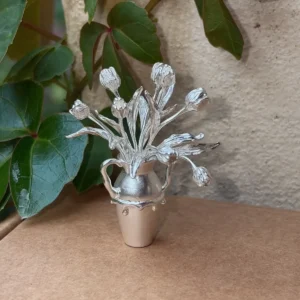 Tulip flowers arranged in a miniature 990 silver vase