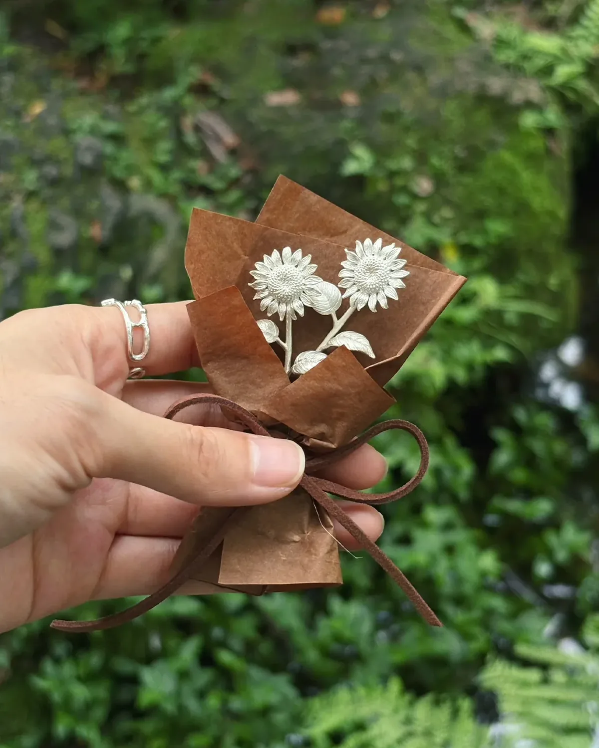 Double-Stem Silver Sunflower Gift Double-stem sterling silver sunflower bouquet in brown paper