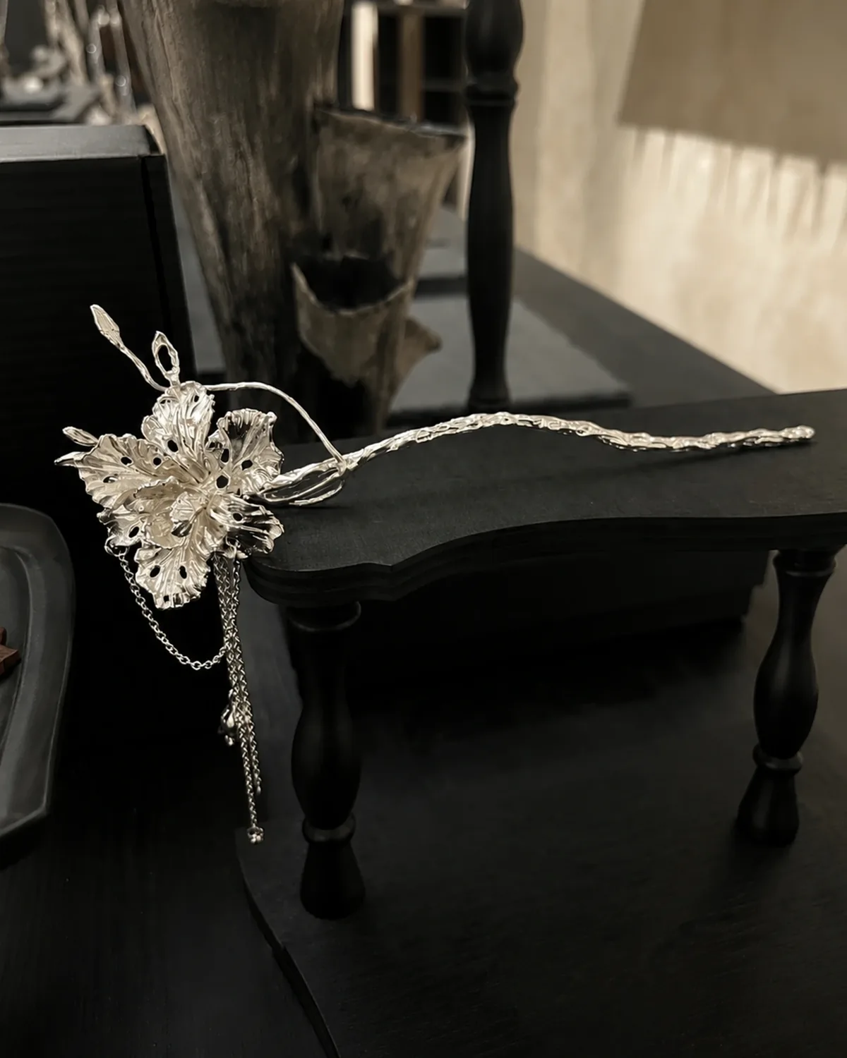 950 Silver Iris Flower Hair Stick Sculptural 950 silver iris flower hair stick laid on a dark table