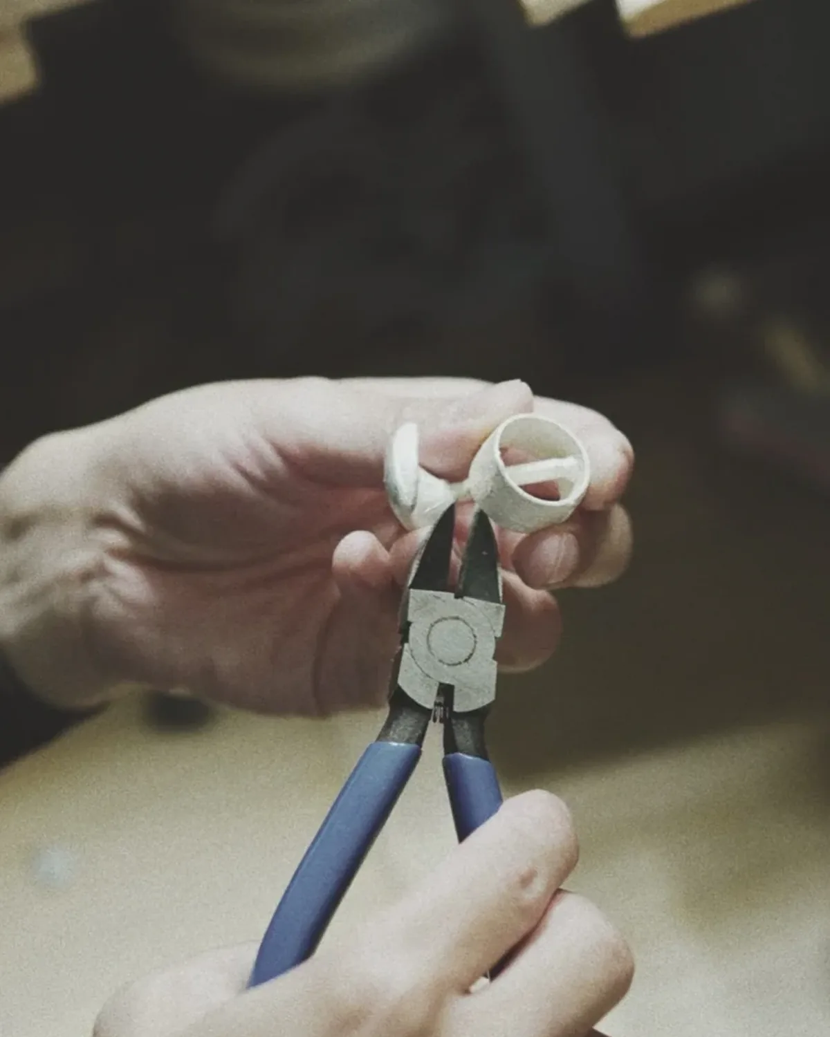Silver Ring Shaped at the Bench Designer-maker shaping a silver ring with pliers at the workbench