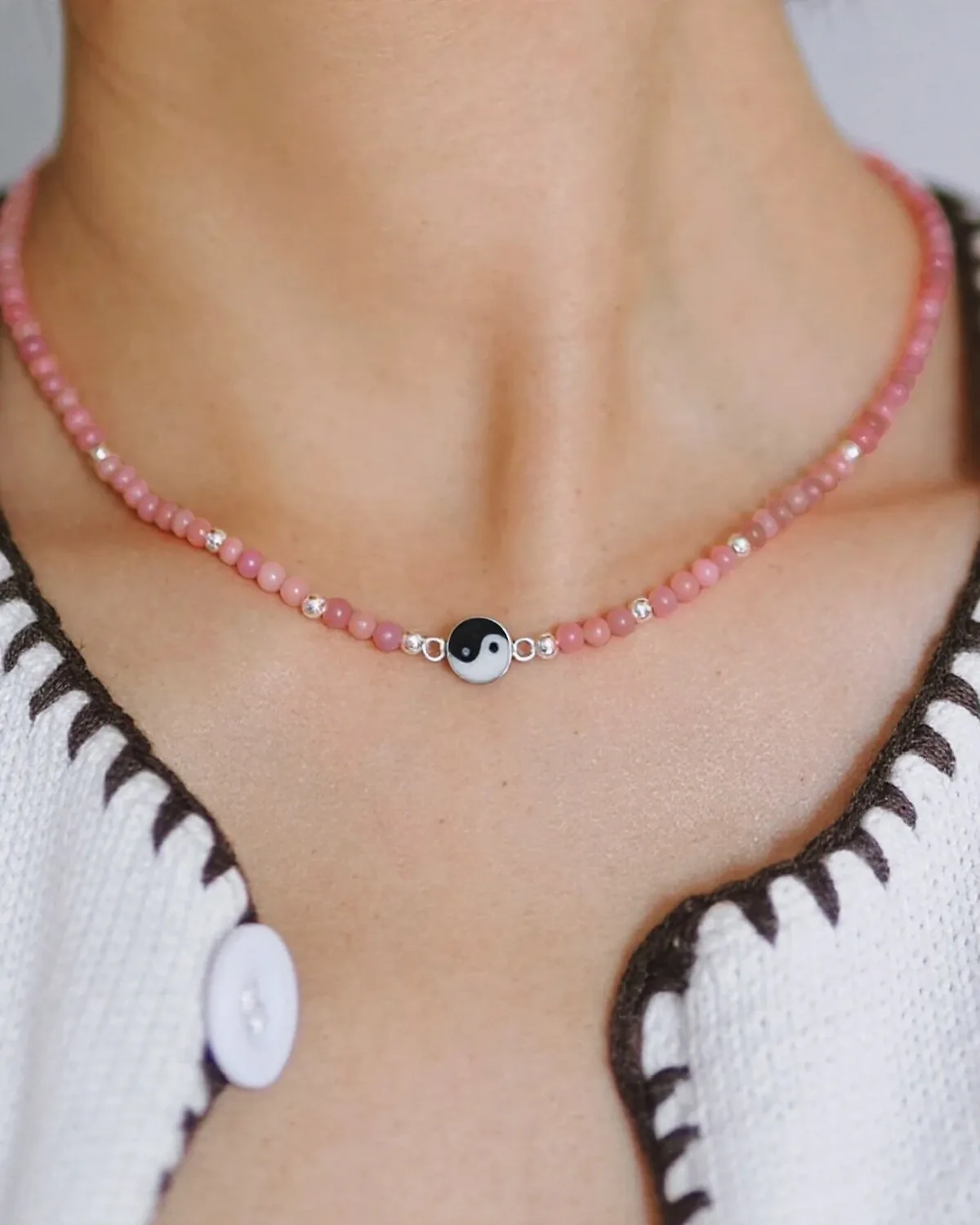 Tender Tai Chi Rhodonite Necklace Pink rhodonite and silver yin-yang necklace worn at the collarbone